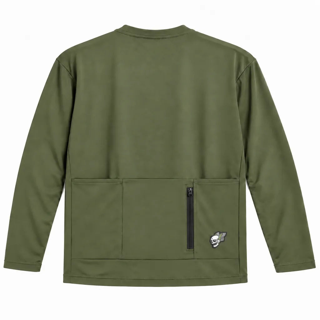 An olive green long-sleeve pullover jacket shown from the back, featuring two large front utility pockets with a vertical black zipper between them and a small embroidered wolf logo patch on the lower right pocket.