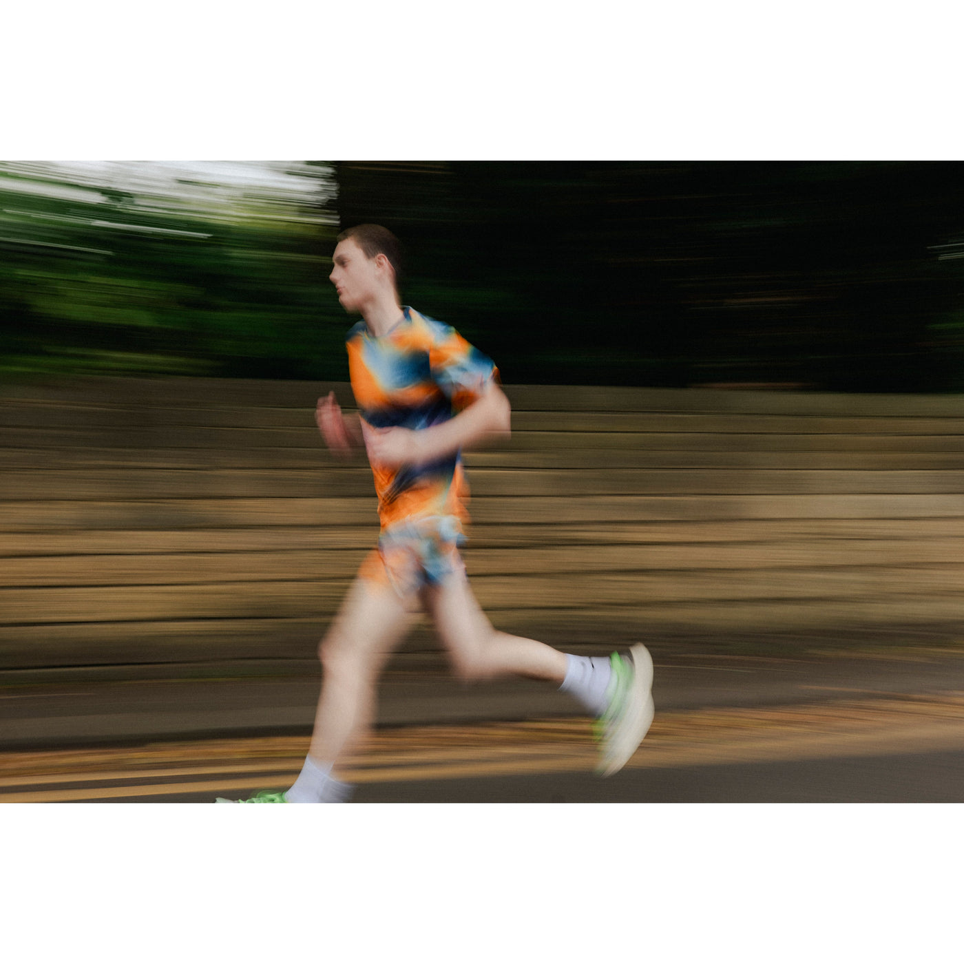 Person running outdoors with a blurred background