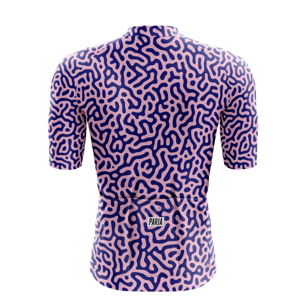 [design:Kinetic] Back view. A short sleeve cycling jersey featuring a geometric pattern in purple and blue colors.