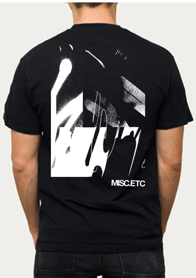 Black graphic t-shirt with bold abstract white back print – PARIA x MISC.ETC streetwear collaboration for off-bike cycling lifestyle