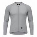 A light gray long-sleeve cycling jersey with a full-length front zipper, raglan sleeves, and a subtle textured pattern, shown on a plain white background.