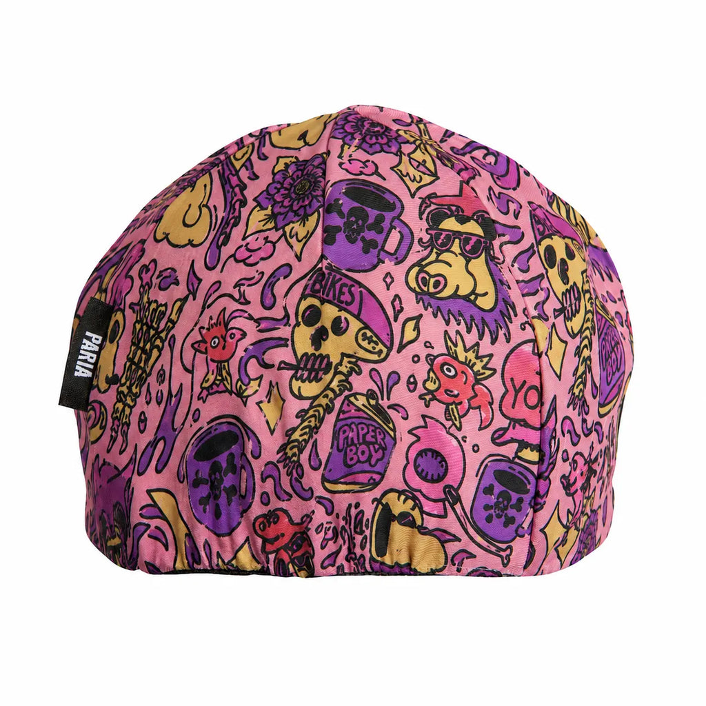 Colorful beanie with cartoonish designs on a pink background