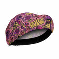 Colorful bicycle helmet with cartoon designs and 'Parra' branding on a white background