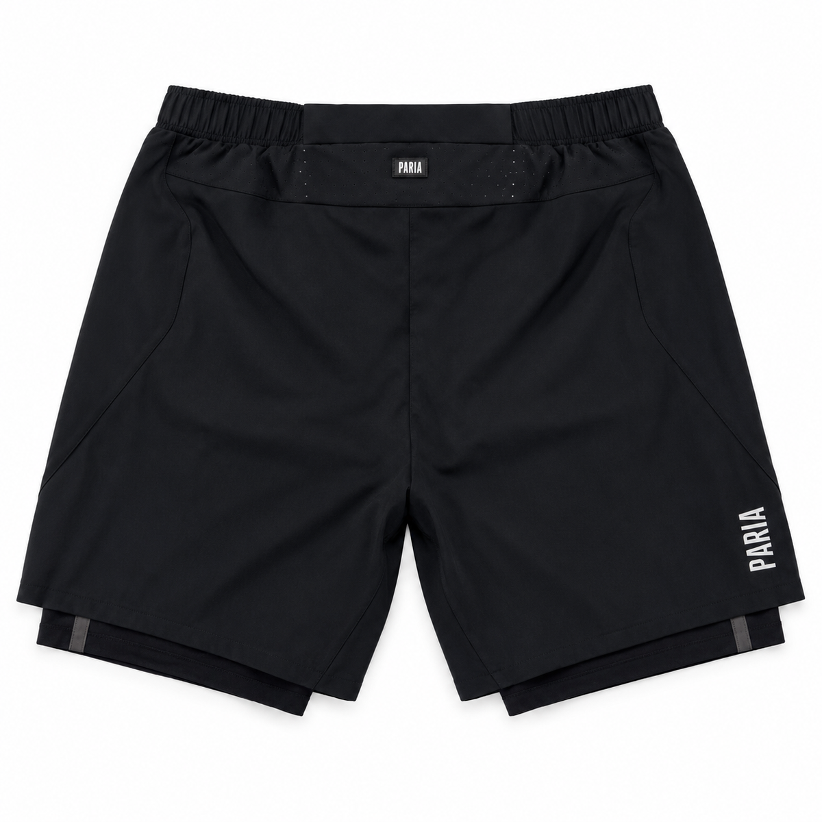 Black athletic shorts with an elastic waistband, featuring a small white 'PARIA' logo on the left hip and a larger vertical logo on the right leg, shown flat on a white background.