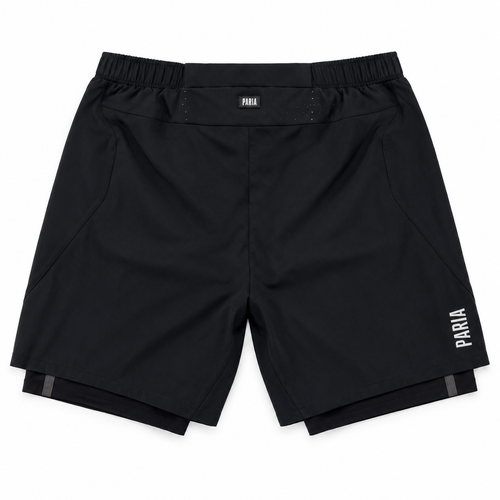 Black athletic shorts with an elastic waistband, featuring a small white 'PARIA' logo on the left hip and a larger vertical logo on the right leg, shown flat on a white background.