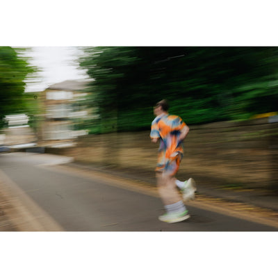 Person running on a road with blurred motion