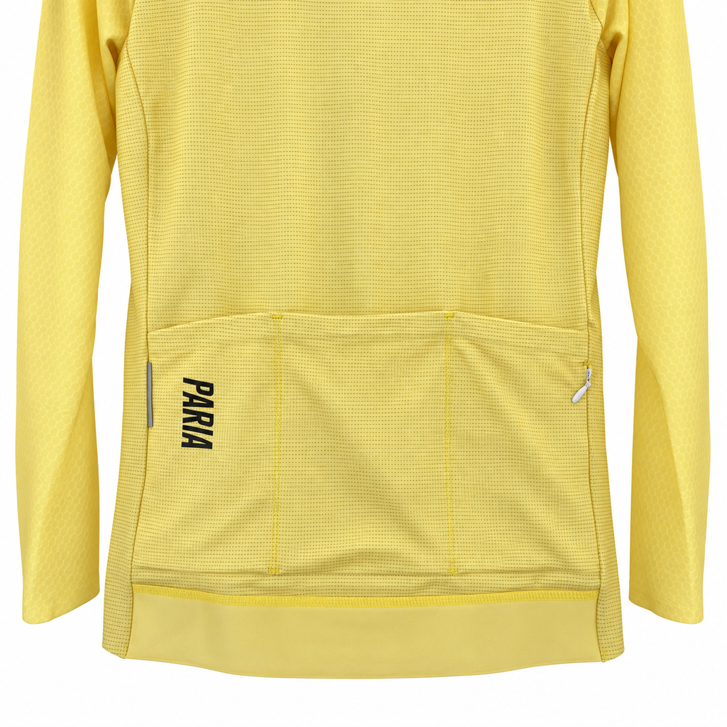 Close-up of the back of a yellow long-sleeve cycling jersey with a large rear pocket and the brand name 'PARA' printed vertically in black on the pocket.