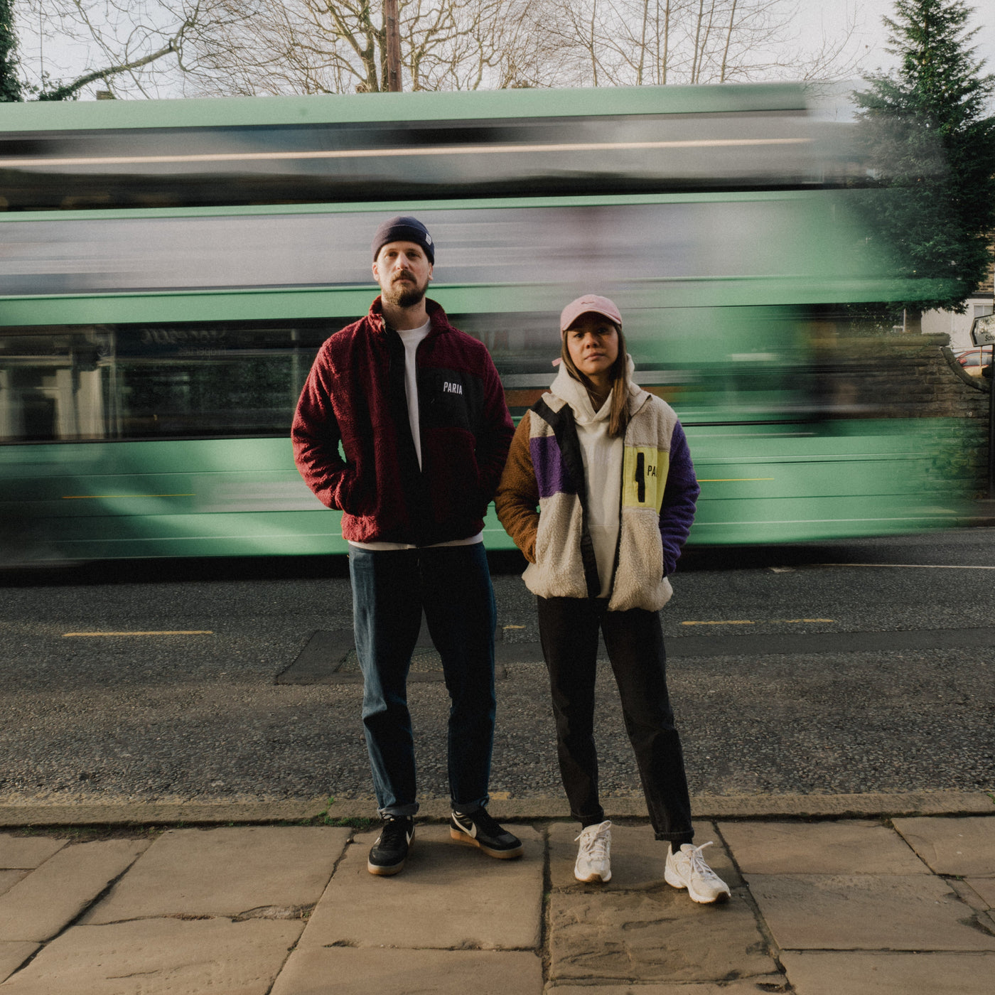 A purple fleece cycling jacket with zip pockets and contrast zips, featuring a collar and the brand name 'Paria' on the chest.