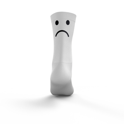 White sock with a sad face design on a white background