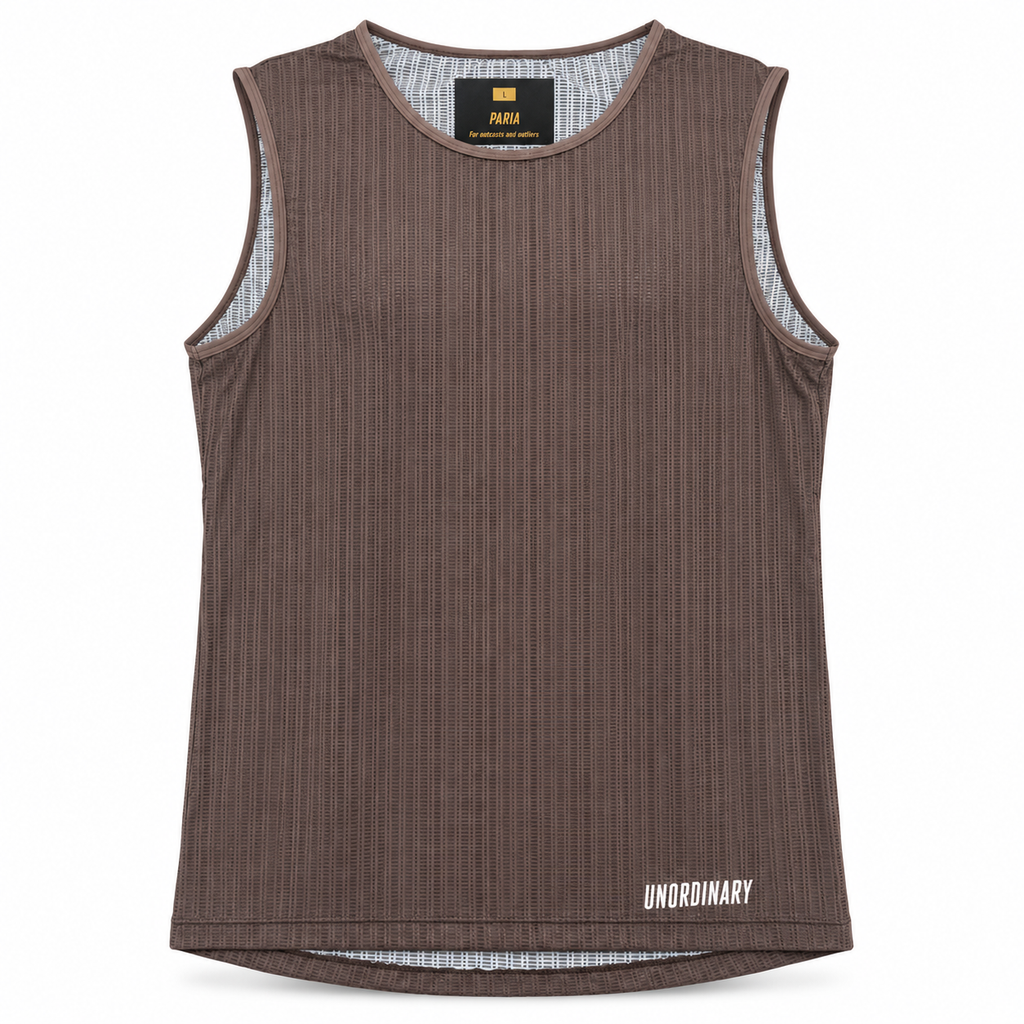 A sleeveless ribbed tank top in dark brown, featuring a white 'UNORDINARY' logo on the bottom right hem and a black neck label with yellow branding.