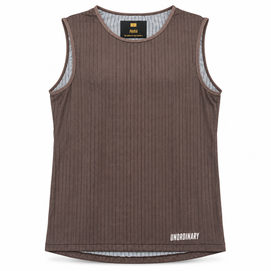 A sleeveless ribbed tank top in dark brown, featuring a white 'UNORDINARY' logo on the bottom right hem and a black neck label with yellow branding.