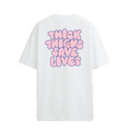 White crew neck t-shirt with the text 'THICK THIGHS SAVE LIVES' printed in bold pink font on the back.